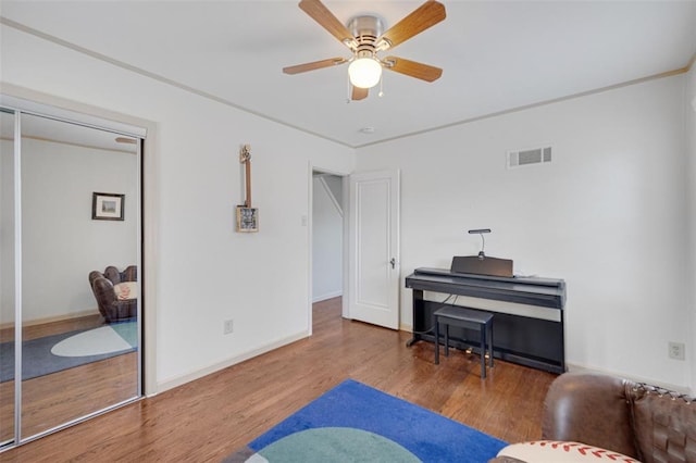 2831 Dunkirk Dr, Saint Louis, MO 63119 - living area with wood finished floors, a ceiling fan, and baseboards