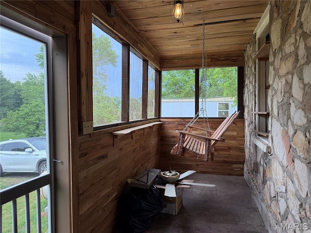 929 Race St, Thayer, MO 65791 - sunroom / solarium featuring healthy amount of natural light, wood walls, and wooden ceiling