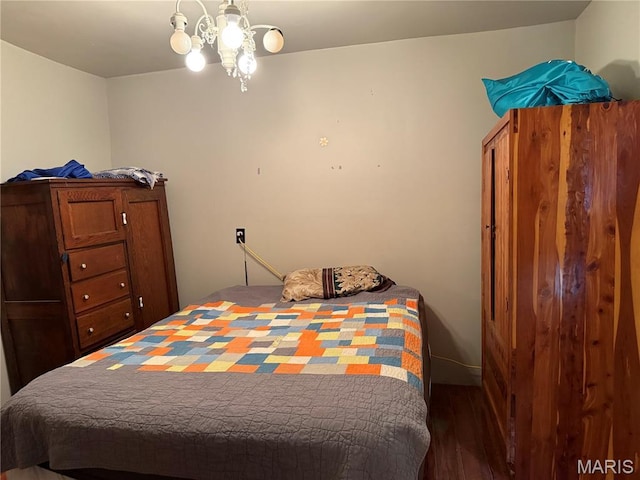 929 Race St, Thayer, MO 65791 - bedroom featuring wood finished floors and a chandelier