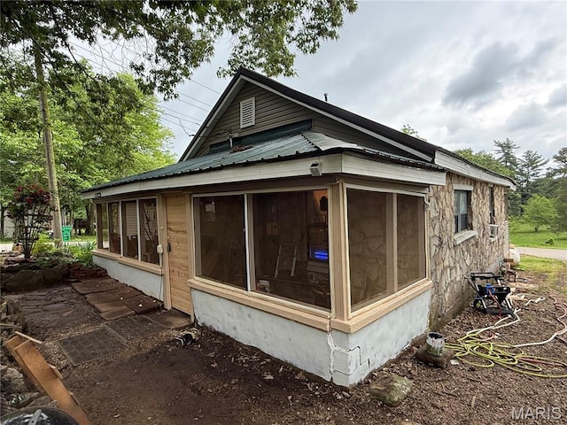 929 Race St, Thayer, MO 65791 - view of side of home featuring a sunroom