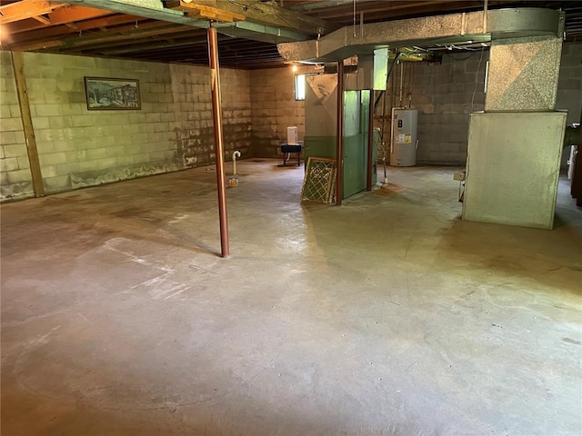 500 E 10th St, Salem, MO 65560 - unfinished below grade area featuring electric water heater and heating unit