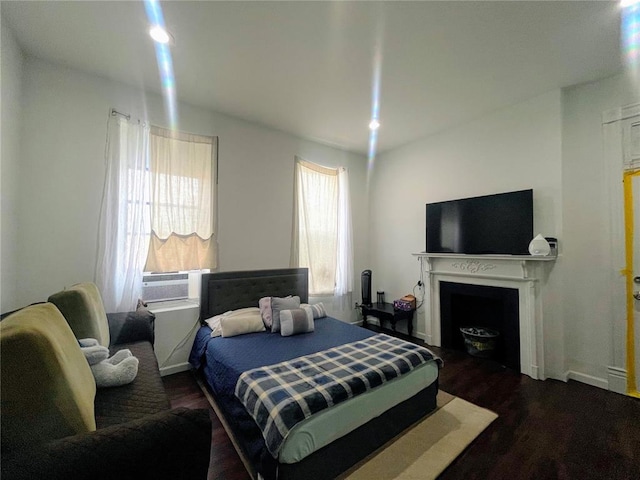 3819 Nebraska Ave, Saint Louis, MO 63118 - bedroom featuring wood finished floors and a fireplace