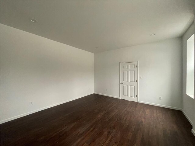 3819 Nebraska Ave, Saint Louis, MO 63118 - spare room featuring dark wood finished floors and baseboards