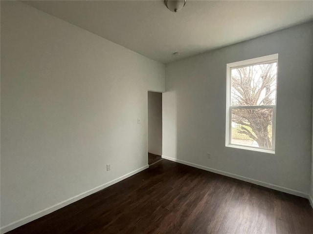 3819 Nebraska Ave, Saint Louis, MO 63118 - empty room with dark wood finished floors and baseboards