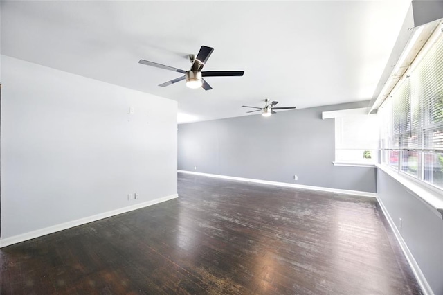 7448 Ahern Ave, Saint Louis, MO 63130 - spare room featuring a ceiling fan, wood finished floors, and baseboards