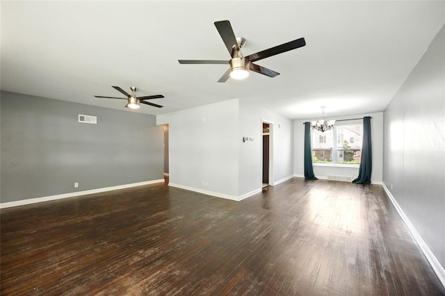 7448 Ahern Ave, Saint Louis, MO 63130 - spare room featuring ceiling fan, a chandelier, dark wood-type flooring, and baseboards