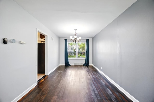 7448 Ahern Ave, Saint Louis, MO 63130 - unfurnished dining area featuring wood finished floors, a chandelier, and baseboards