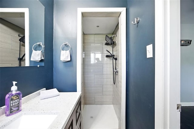 7448 Ahern Ave, Saint Louis, MO 63130 - bathroom featuring vanity and a tile shower