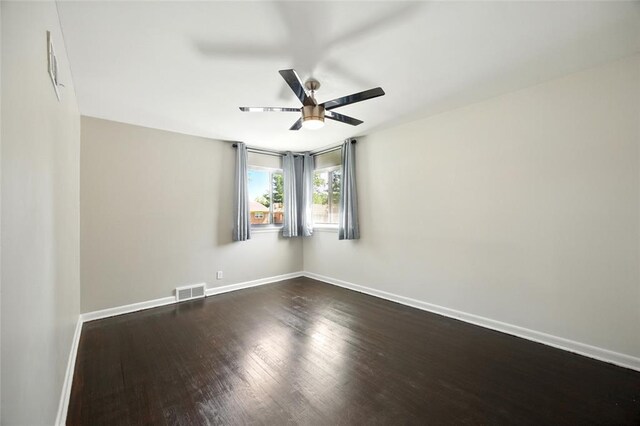 7448 Ahern Ave, Saint Louis, MO 63130 - unfurnished room featuring a ceiling fan, dark wood-style flooring, and baseboards