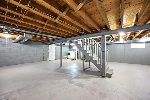 7448 Ahern Ave, Saint Louis, MO 63130 - below grade area featuring stairway and washer / clothes dryer