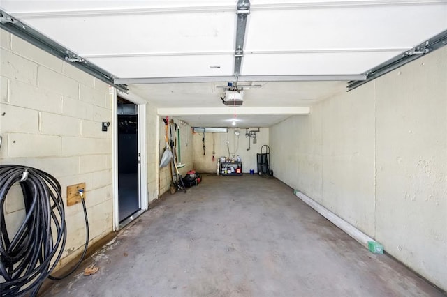 7448 Ahern Ave, Saint Louis, MO 63130 - garage featuring a garage door opener