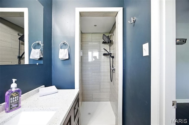 7448 Ahern Ave, Saint Louis, MO 63130 - bathroom with vanity and a tile shower