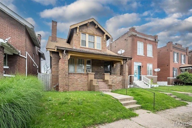 4545 Alice Ave, Saint Louis, MO 63115 - view of front of house with brick siding, a chimney, a front yard, and covered porch