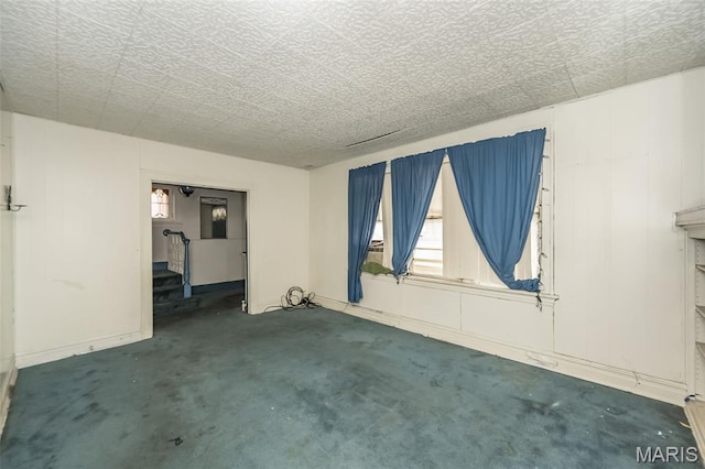 4545 Alice Ave, Saint Louis, MO 63115 - carpeted spare room with stairway