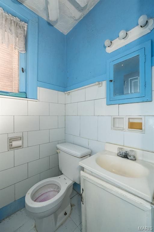 4545 Alice Ave, Saint Louis, MO 63115 - bathroom with vanity and tile walls