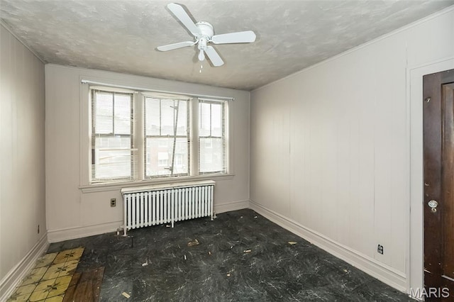 4545 Alice Ave, Saint Louis, MO 63115 - spare room featuring radiator heating unit and a ceiling fan