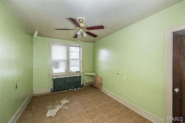 4545 Alice Ave, Saint Louis, MO 63115 - tiled spare room featuring radiator heating unit and ceiling fan