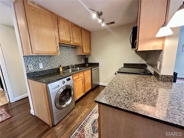 5330 Pershing Ave Unit 402, Saint Louis, MO 63112 - kitchen featuring washer / dryer, a sink, stainless steel dishwasher, range, and tasteful backsplash
