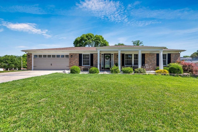 11943 Brookington Dr, Bridgeton, MO 63044 - single story home with an attached garage, a porch, brick siding, driveway, and a front lawn