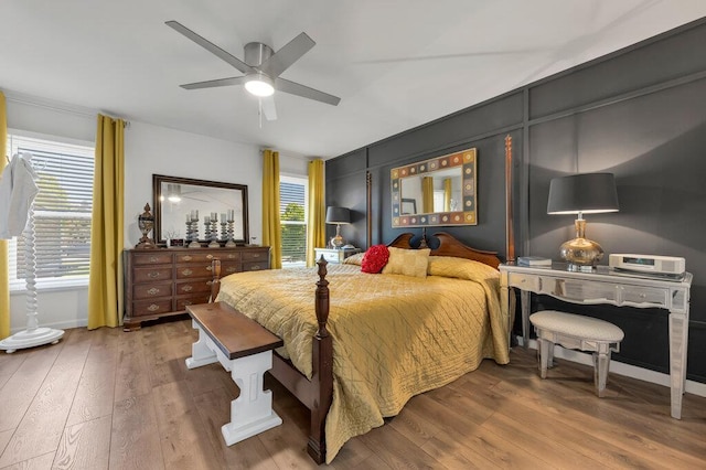 11943 Brookington Dr, Bridgeton, MO 63044 - bedroom featuring wood finished floors, ceiling fan, and baseboards