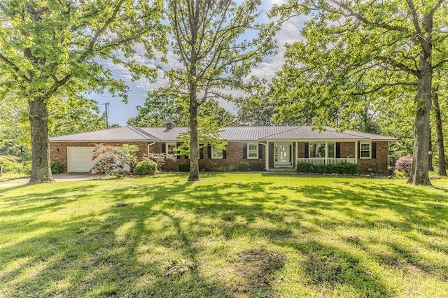 21509 Rockwell Dr, Lebanon, MO 65536 - single story home with brick siding, an attached garage, a front lawn, and metal roof