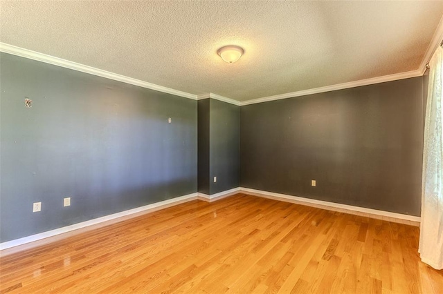 21509 Rockwell Dr, Lebanon, MO 65536 - empty room with wood finished floors, a textured ceiling, ornamental molding, and baseboards