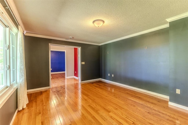 21509 Rockwell Dr, Lebanon, MO 65536 - empty room with wood-type flooring, a textured ceiling, ornamental molding, and baseboards