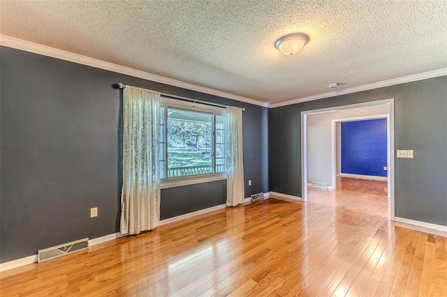 21509 Rockwell Dr, Lebanon, MO 65536 - empty room with a textured ceiling, light wood-type flooring, ornamental molding, and baseboards