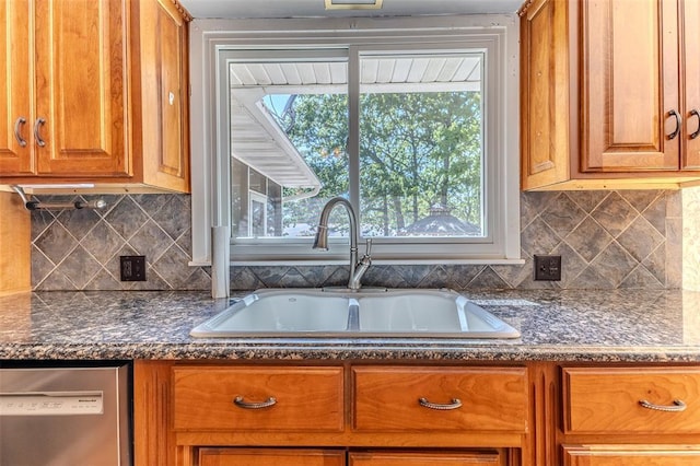 21509 Rockwell Dr, Lebanon, MO 65536 - kitchen featuring a sink, stainless steel dishwasher, brown cabinetry, and backsplash