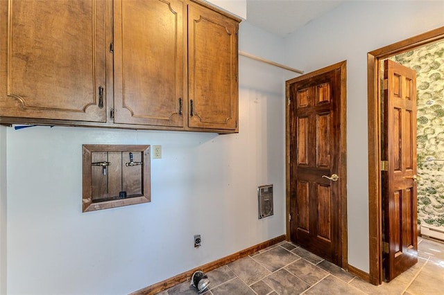 21509 Rockwell Dr, Lebanon, MO 65536 - washroom featuring cabinet space, baseboards, electric dryer hookup, and heating unit