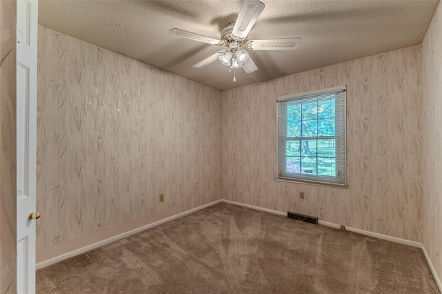 21509 Rockwell Dr, Lebanon, MO 65536 - spare room with carpet floors, a ceiling fan, a textured ceiling, and baseboards