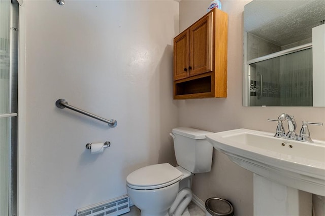 21509 Rockwell Dr, Lebanon, MO 65536 - full bathroom with toilet, an enclosed shower, a baseboard heating unit, a sink, and baseboards