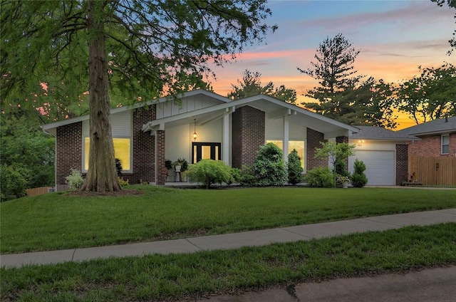 402 Glan Tai Dr, Manchester, MO 63011 - view of front of home with brick siding and an attached garage
