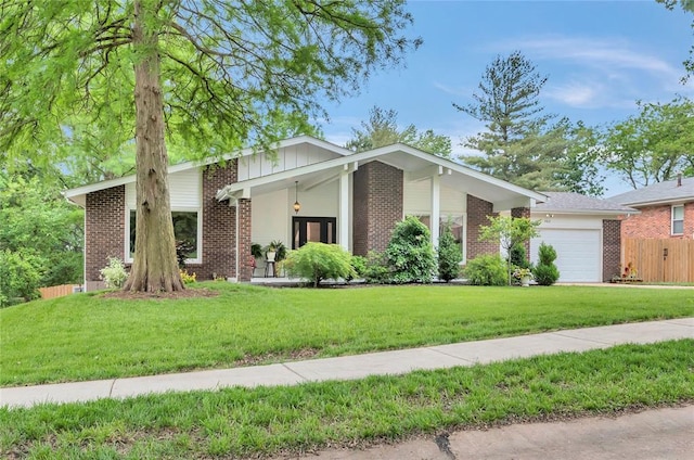 402 Glan Tai Dr, Manchester, MO 63011 - mid-century home with a garage and brick siding