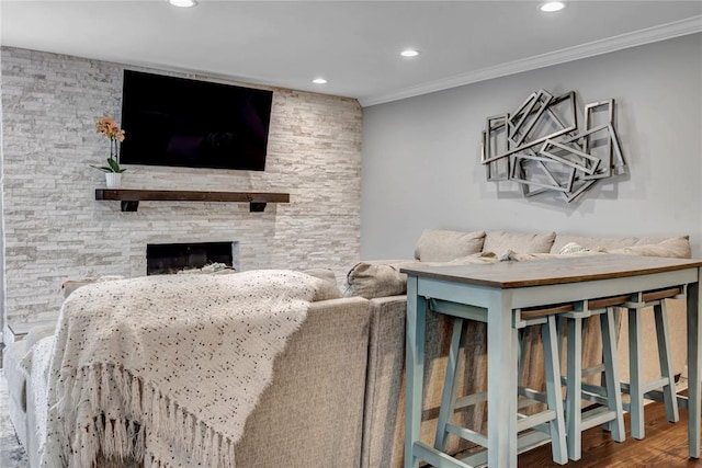 402 Glan Tai Dr, Manchester, MO 63011 - living area featuring recessed lighting, ornamental molding, wood finished floors, and a stone fireplace