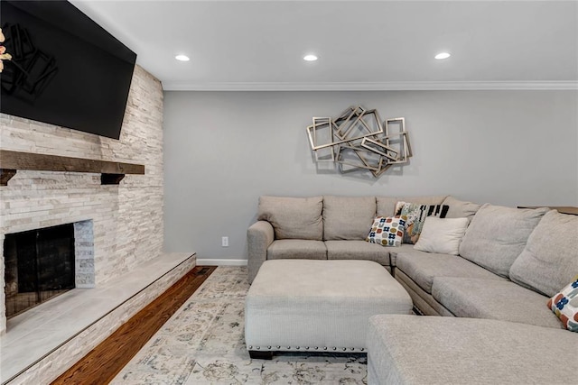 402 Glan Tai Dr, Manchester, MO 63011 - living area featuring wood finished floors, ornamental molding, recessed lighting, a stone fireplace, and baseboards