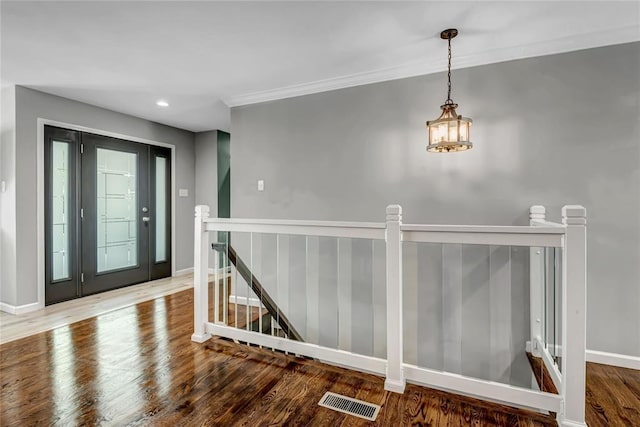 402 Glan Tai Dr, Manchester, MO 63011 - entryway featuring wood finished floors, baseboards, recessed lighting, and crown molding