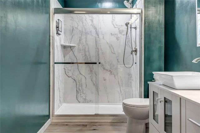 402 Glan Tai Dr, Manchester, MO 63011 - bathroom with toilet, a marble finish shower, double vanity, and wood finished floors