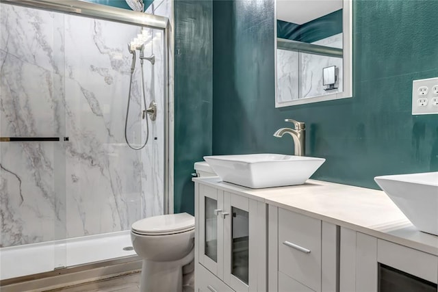 402 Glan Tai Dr, Manchester, MO 63011 - bathroom with double vanity, toilet, and a marble finish shower
