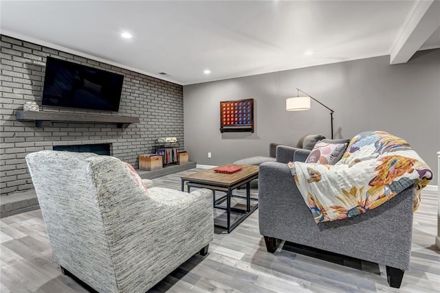 402 Glan Tai Dr, Manchester, MO 63011 - living area featuring wood finished floors, recessed lighting, a fireplace, ornamental molding, and brick wall