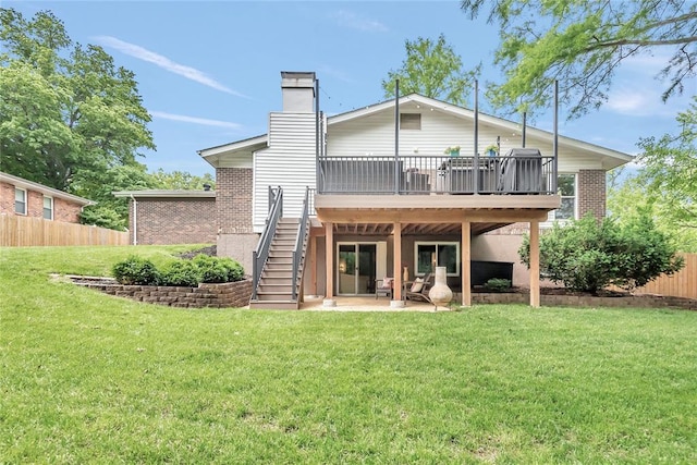 402 Glan Tai Dr, Manchester, MO 63011 - rear view of house featuring stairway, a deck, a patio, a chimney, and brick siding