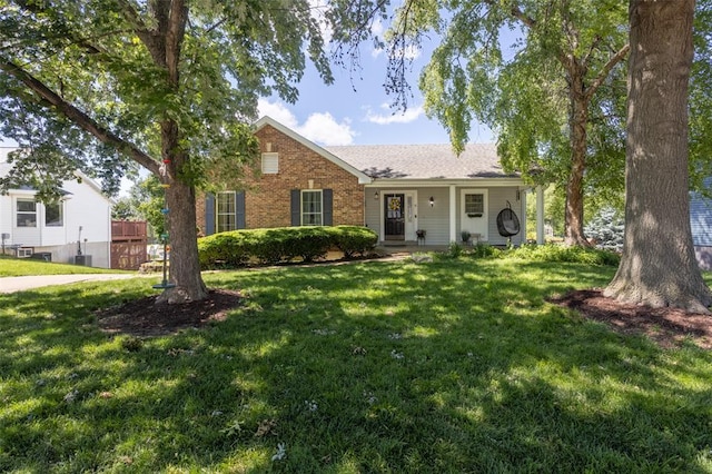 4 Aken Ct, Saint Peters, MO 63376 - view of front of house with a front yard, roof with shingles, and brick siding