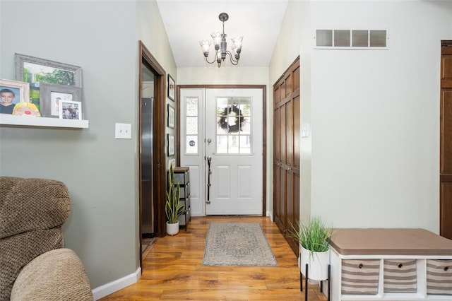 4 Aken Ct, Saint Peters, MO 63376 - foyer featuring light wood-type flooring, a chandelier, and baseboards