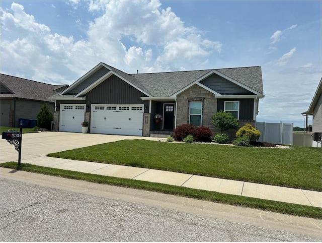 craftsman house featuring an attached garage, concrete driveway, board and batten siding, stone siding, and a shingled roof