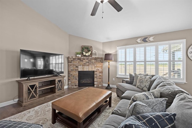 536 W 5th St, Saint Jacob, IL 62281 - living room with a fireplace, ceiling fan, baseboards, wood finished floors, and vaulted ceiling