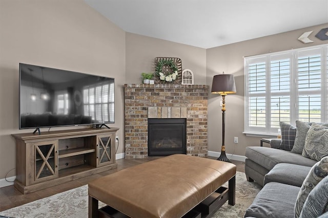 536 W 5th St, Saint Jacob, IL 62281 - living area with a fireplace, baseboards, and wood finished floors