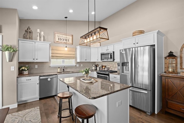 536 W 5th St, Saint Jacob, IL 62281 - kitchen featuring appliances with stainless steel finishes, a sink, white cabinets, decorative backsplash, and recessed lighting