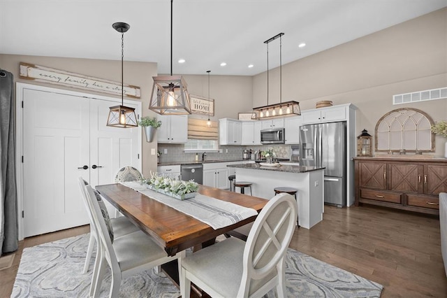 536 W 5th St, Saint Jacob, IL 62281 - dining area with dark wood-style floors, a high ceiling, and recessed lighting