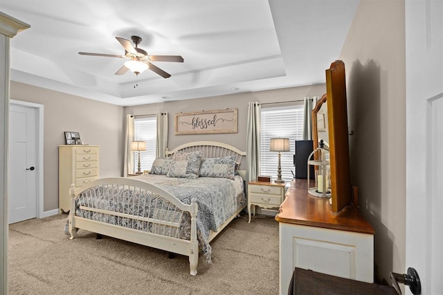 536 W 5th St, Saint Jacob, IL 62281 - bedroom with a tray ceiling, light carpet, and a ceiling fan