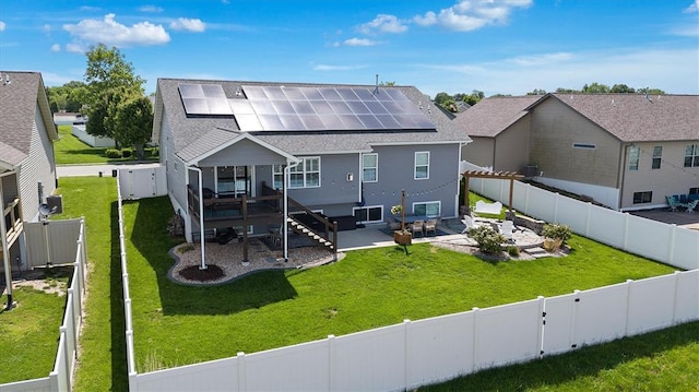 536 W 5th St, Saint Jacob, IL 62281 - rear view of property featuring roof mounted solar panels, a patio area, a shingled roof, stairs, and a residential view